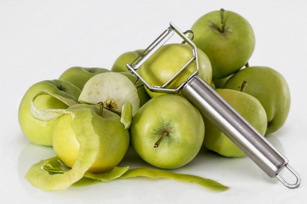green-unripe-apple-with-silver-peeler-39354